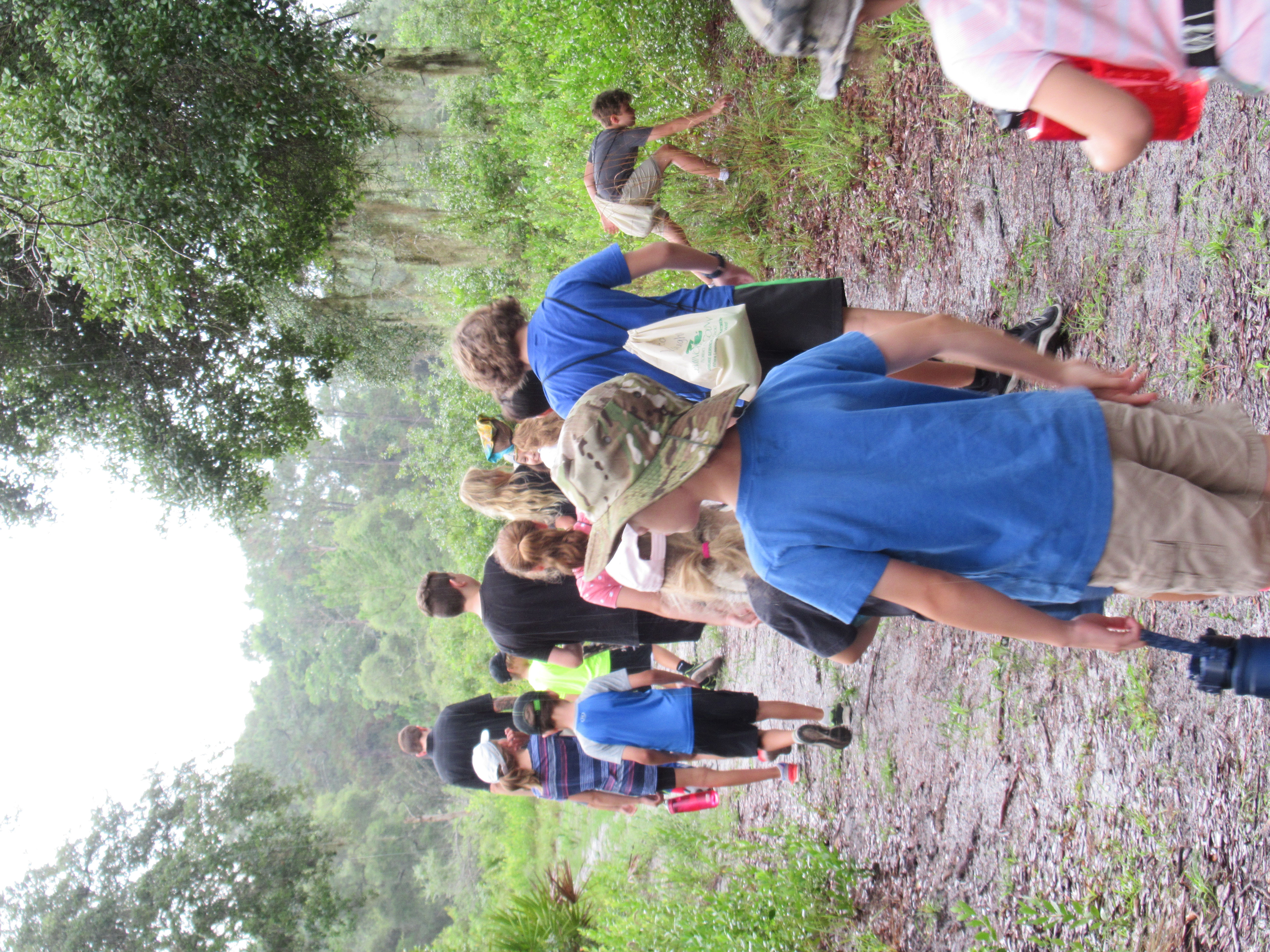 school group walking down a lush trail at the Geneva Wilderness Area