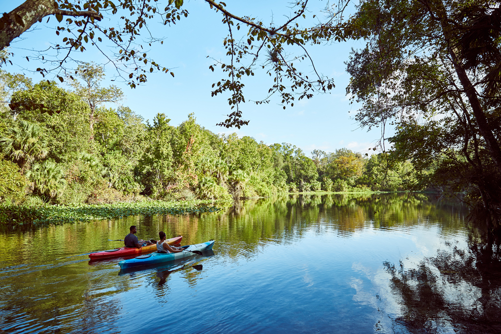 two Seminole County residents canoeing down a river