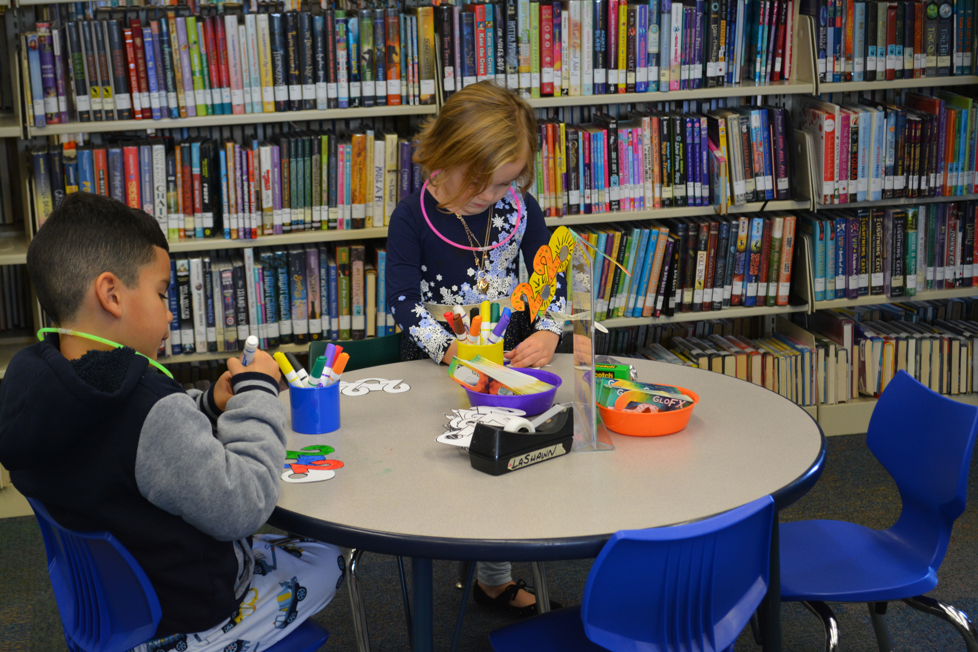 Kids engaged in an activity at an in-library children's program